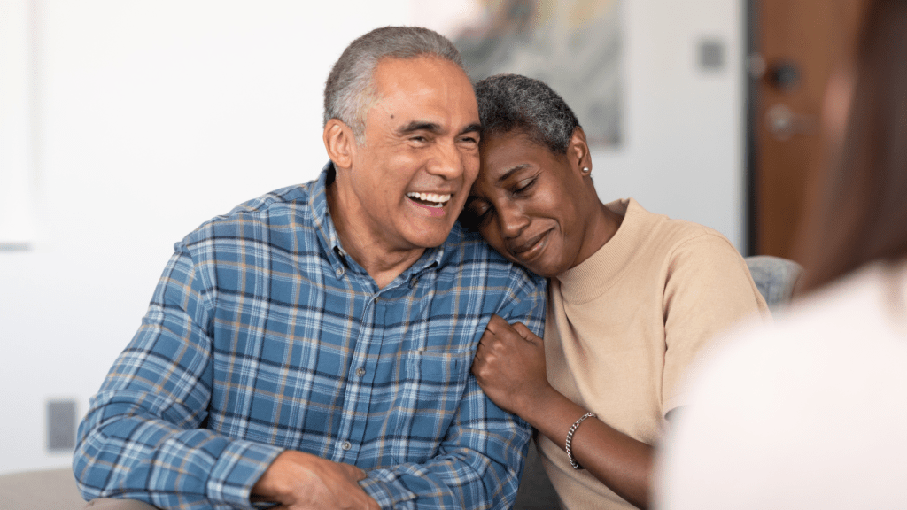 Married couples embracing one another